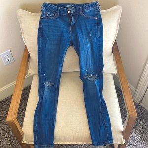 Dark wash, distressed skinny jeans